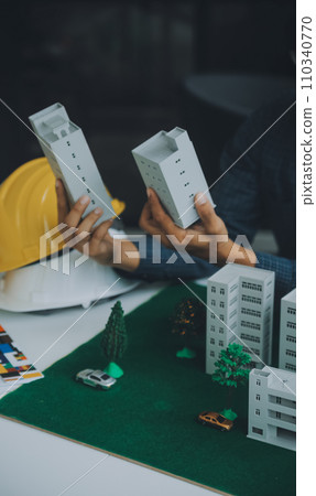 Construction and structure concept of Engineer or architect meeting for project working with partner and engineering tools on model building and blueprint in working site, contract for both companies. 110340770