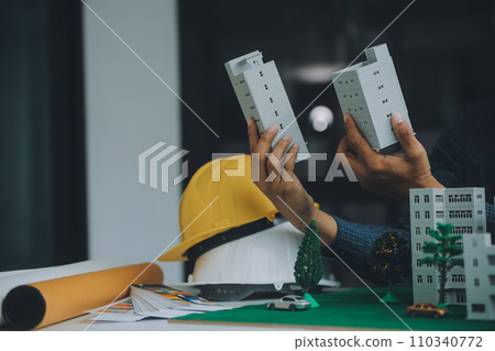 Construction and structure concept of Engineer or architect meeting for project working with partner and engineering tools on model building and blueprint in working site, contract for both companies. 110340772