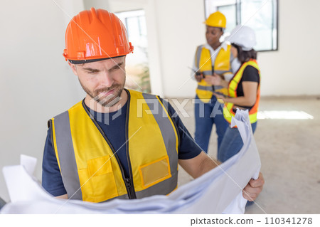 Professional construction worker engineer male. Real estate house project builder. Smart architect man standing work in construction site. 110341278