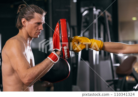 boxing coach training punch kickboxing with athlete focus trainer in fitness gym for muscle and healthy sport 110341324