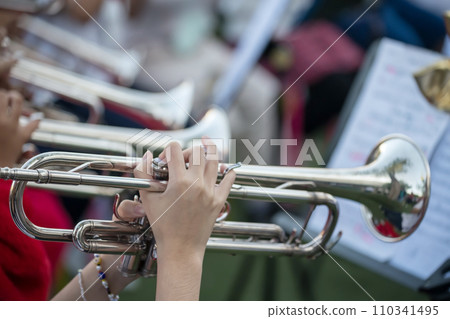 musician hands playing trumpet in school band concert musician hands playing trumpet in school band concert 110341495