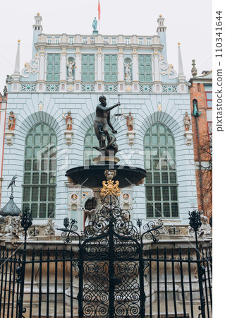 Triton statue on the market square in Gdansk, Poland. Beautiful old houses historical part of downtown, Neptune fountain, Vacation concept 110341644