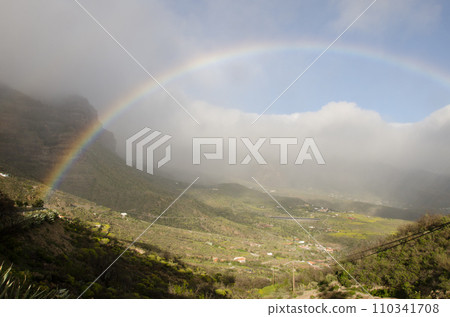 Rainbow over the Tirajana crater. Rainbow over the Tirajana crater. 110341708