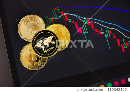 Various coins on digital tablet with graph Various coins on digital tablet with graph 110342112