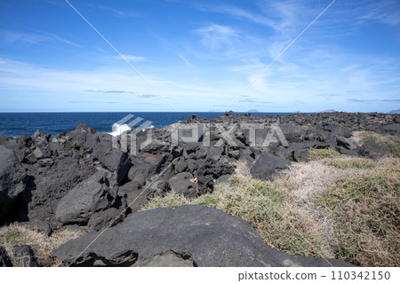 Volcanic rocks on the coast, Lanzarote, Spain 110342150