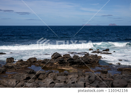 Volcanic rocks on the coast, Lanzarote, Spain 110342156