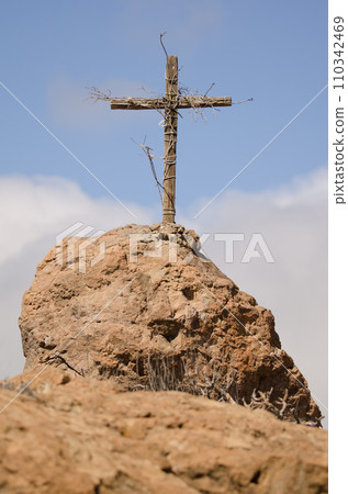 Wooden cross covered with branches. Wooden cross covered with branches. 110342469