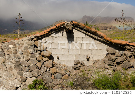House with one block wall and one collapsed stone wall. House with one block wall and one collapsed stone wall. 110342525