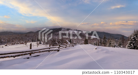 Countryside hills, groves and farmlands in winter remote alpine mountain village Countryside hills, groves and farmlands in winter remote alpine mountain village 110343017