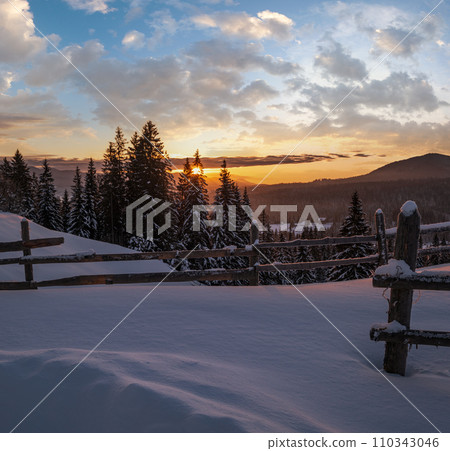 Small and quiet alpine village outskirts and winter sunrise snowy mountains around, Voronenko, Carpathian, Ukraine. Small and quiet alpine village outskirts and winter sunrise snowy mountains around, Voronenko, Carpathian, Ukraine. 110343046