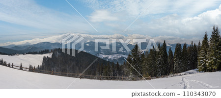 Winter remote alpine mountain village outskirts, countryside hills, groves and farmlands. Winter remote alpine mountain village outskirts, countryside hills, groves and farmlands. 110343070