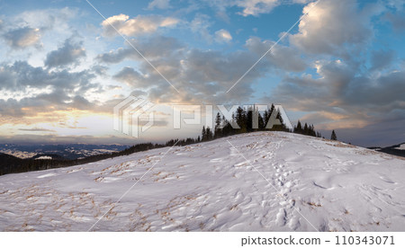 Winter remote alpine mountain village outskirts, countryside hills, groves and farmlands. Winter remote alpine mountain village outskirts, countryside hills, groves and farmlands. 110343071