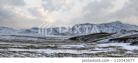 Colorful Landmannalaugar mountains under snow cover in autumn, southern Highlands of Iceland. Frostastadavatn lake at the foot of the mountains. 110343077