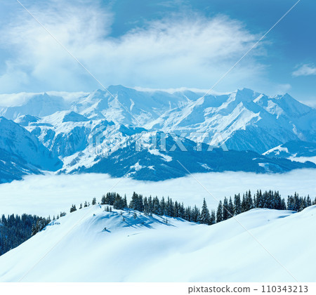 Cloudy sunny winter mountain landscape Cloudy sunny winter mountain landscape 110343213