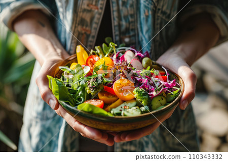 Woman holds a colorful salad in a bowl. Healthy vegetarian dinner. Generative AI Woman holds a colorful salad in a bowl. Healthy vegetarian dinner. Generative AI 110343332