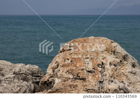 Stones on the coast of the Ionian sea, Roda, Corfu Stones on the coast of the Ionian sea, Roda, Corfu 110343569