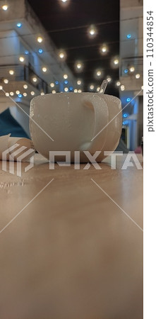 Cappuccino and chocolate bread on the table 110344854