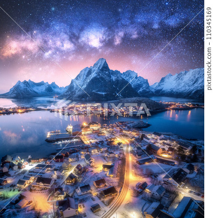 Milky Way, snowy village, sea, mountain, sky at winter night Milky Way, snowy village, sea, mountain, sky at winter night 110345169