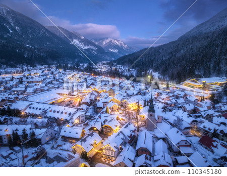 Aerial view of beautiful alpine village at cold winter night 110345180