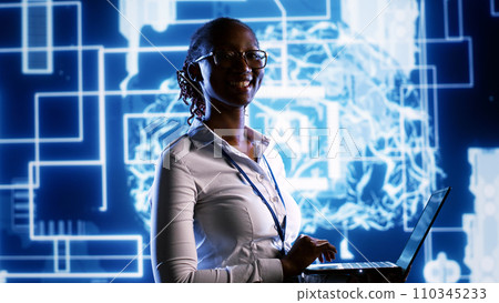 Portrait of happy engineer updating AI systems, writing intricate binary code scripts on laptop. Computer scientist using programming to upgrade artificial intelligence simulation model 110345233