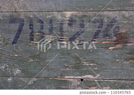 Green wood texture background from army ammunition wooden crate with abstract number. Green wood texture background from army ammunition wooden crate with abstract number. 110345765