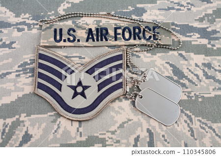 August 31, 2020. US AIR FORCE branch tape and Staff Sergeant rank patch and dog tags on digital tiger stripe pattern Airman Battle Uniform (ABU) 110345806