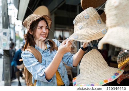 Young Asian woman backpack traveler traveling at local market. Journey trip lifestyle Young Asian woman backpack traveler traveling at local market. Journey trip lifestyle 110346630
