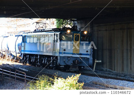 A tank freight train pulled by an electric locomotive EF65 A tank freight train pulled by an electric locomotive EF65 110346672