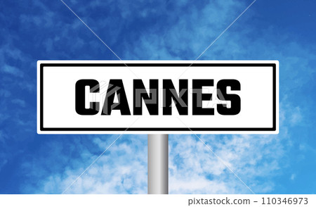 Cannes road sign on sky background 110346973