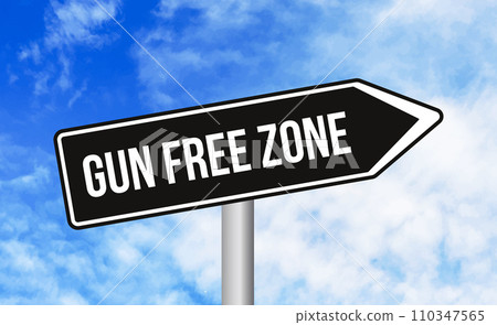 Gun free zone road sign on sky background 110347565