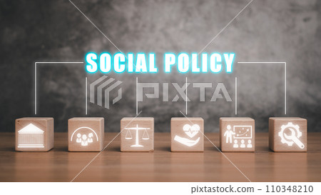 Social policy concept, Wooden block on desk with social policy icon on virtual screen. Social policy concept, Wooden block on desk with social policy icon on virtual screen. 110348210