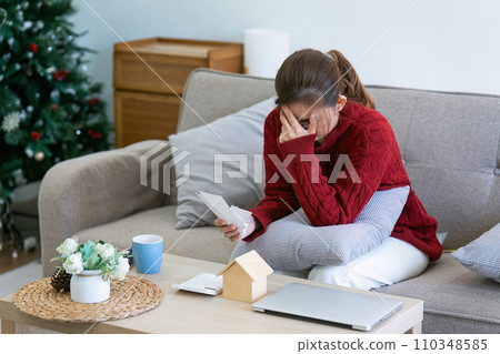 woman having financial debts issues problems, calculating domestic bills, paying losing money at home 110348585