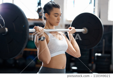 Fitness, workout and exercise woman with barbell in gym for health, cardio and wellness. Strength, sports and healthy bodybuilder or athlete training for weight power lifting and muscle competition 110349021