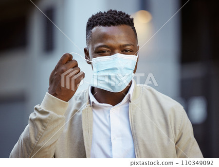 Happy end of covid, with businessman removing face mask in urban city with vision, goal for success after covid 19. Smile, trust and leadership portrait of corporate worker post covid or corona virus Happy end of covid, with businessman removing face mask in urban city with vision, goal for success after covid 19. Smile, trust and leadership portrait of corporate worker post covid or corona virus 110349092