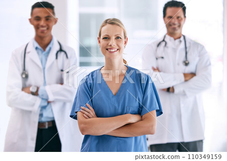Portrait of medical doctors with crossed arms with a stethoscope standing in the hospital hallway. Happy healthcare workers after clinic trial, surgery or consultation success at a medicare center. 110349159