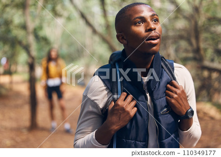 Hiking young black man in forest nature with wow face traveling with backpack in woods. Surprise, happy and active African person or backpacker in trees trekking on jungle freedom adventure in summer Hiking young black man in forest nature with wow face traveling with backpack in woods. Surprise, happy and active African person or backpacker in trees trekking on jungle freedom adventure in summer 110349177