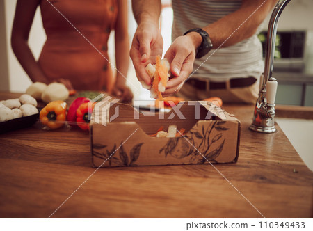 Healthy, clean eating and vegan or vegetarian people preparing cooking ingredients, supplies or consumables. Couple watching their diet, body or weight while gathering vegetables to eat food or meal 110349433