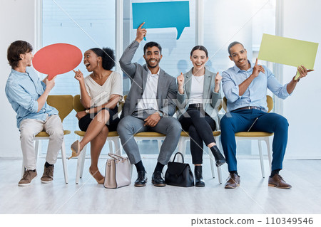 Speech bubbles, voice and vote by business people happy and sitting in an office. A diverse team of employees holding empty comment signs or icons for social media company communication Speech bubbles, voice and vote by business people happy and sitting in an office. A diverse team of employees holding empty comment signs or icons for social media company communication 110349546