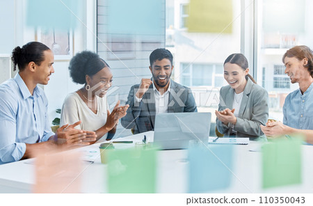 Applause, celebrating and winning market team of employees with good news during a meeting in a boardroom. Happy business people looking at a laptop and clapping hands in victory in an office 110350043