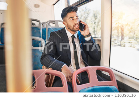 Businessman consulting on a phone call on a bus in the morning travel to work in the city. Entrepreneur, employee and worker speaking to a contact on a mobile cellphone in public transportation Businessman consulting on a phone call on a bus in the morning travel to work in the city. Entrepreneur, employee and worker speaking to a contact on a mobile cellphone in public transportation 110350130