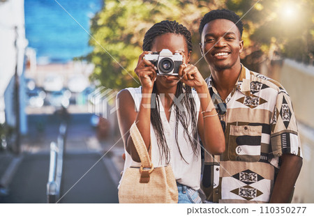 Travel, tourism and young black couple taking photo on a camera, having fun and walking in a city. African american boyfriend and girlfriend bonding, enjoying their relationship and journey together Travel, tourism and young black couple taking photo on a camera, having fun and walking in a city. African american boyfriend and girlfriend bonding, enjoying their relationship and journey together 110350277