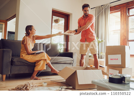 Couple recycle, donate and packing boxes for relocation while moving house for sustainability and eco friendly lifestyle. Saving environment with zero waste for a green, clean and happy future 110350522