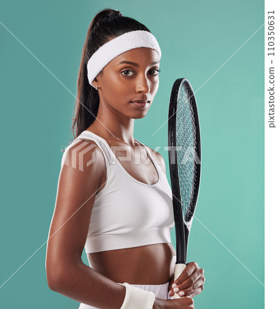 Tennis player, athlete or sports person training for game or match. Fitness, confident and athletic lady posing with a racket for competition. Portrait of black woman female, exercise and workout. Tennis player, athlete or sports person training for game or match. Fitness, confident and athletic lady posing with a racket for competition. Portrait of black woman female, exercise and workout. 110350631