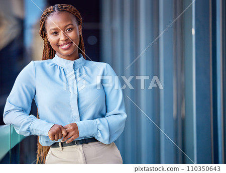 Corporate business woman standing on balcony outside at work, taking a break and looking confident. Portrait of a professional, smiling and cheerful black female manager expressing leadership 110350643
