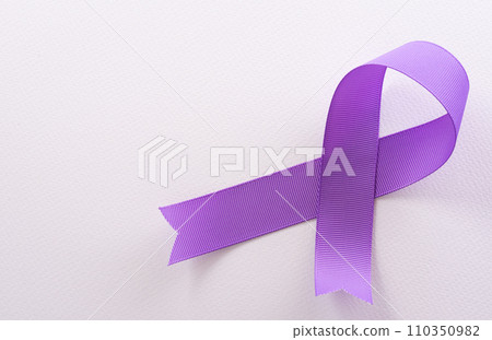 Purple ribbon on white background for supporting World Cancer Day campaign on February 4. 110350982