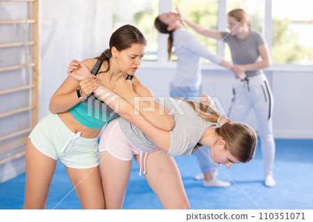 Females practicing self defence moves Females practicing self defence moves 110351071