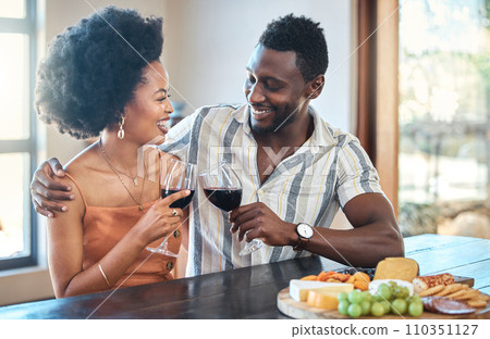 Young couple celebrating with wine and cheers at resort, laugh and bonding on romantic date. Carefree, in love black girlfriend and boyfriend toasting, enjoying relationship, alcohol and conversation 110351127