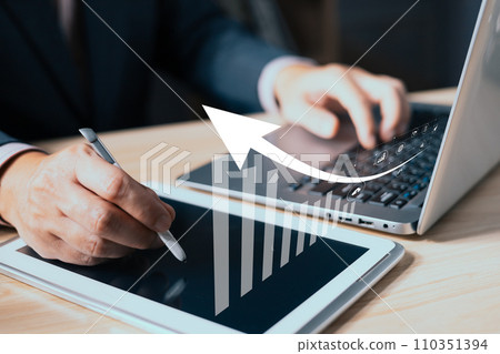man use laptop and tablet with growth graphs and progress of business and analyze finance, and investment.Use technology to plan strategy to success goals and growth stock.online business, online man use laptop and tablet with growth graphs and progress of business and analyze finance, and investment.Use technology to plan strategy to success goals and growth stock.online business, online 110351394