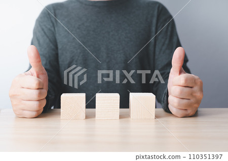 businessman sit on table and wood empty tree blocks with copy space for text or symbols, development concept for growth success process. businessman sit on table and wood empty tree blocks with copy space for text or symbols, development concept for growth success process. 110351397