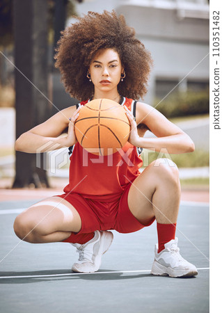 Basketball, training and sport player with a ball ready to start workout, exercise and game. Portrait of a black woman athlete with sports motivation and fitness focus on a outdoors court with beauty 110351482